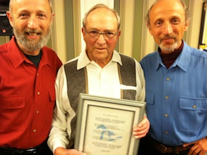 Carlos Fetterolf holding the lyrics to "These Lakes are Your Lakes"