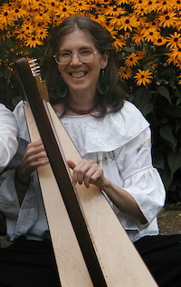 Helen in the garden with her harp.