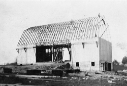 Our barn under construction, circa 1917-18. Our first one was destroyed by a cyclone soon after it was completed.
